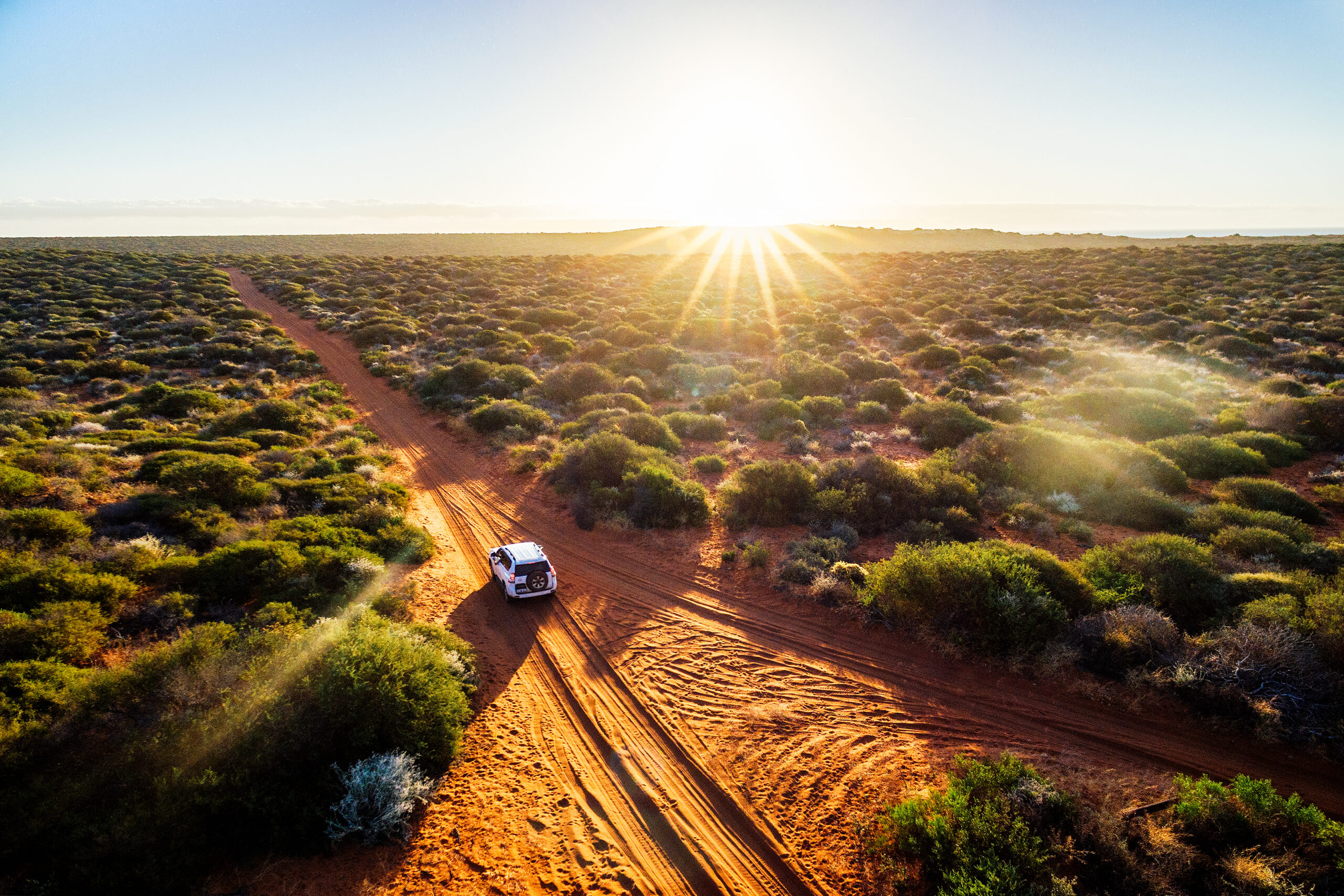 Australia,,Red,Sand,Unpaved,Road,And,4x4,At,Sunset,,Francoise